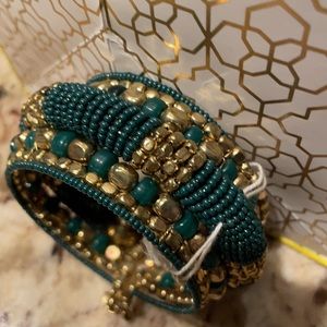 Green & gold tone expandable bracelet.
